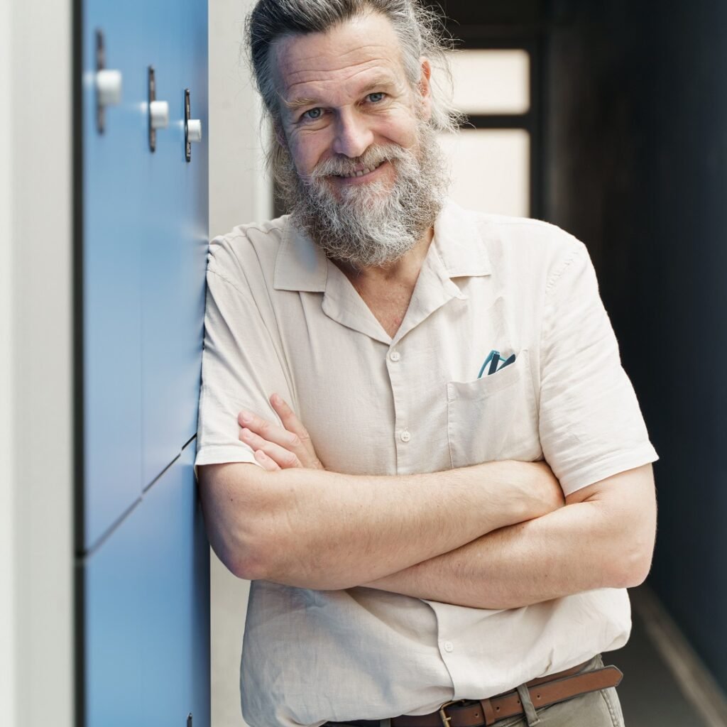 middle aged male teacher with beard standing in sc gkz724k.jpg